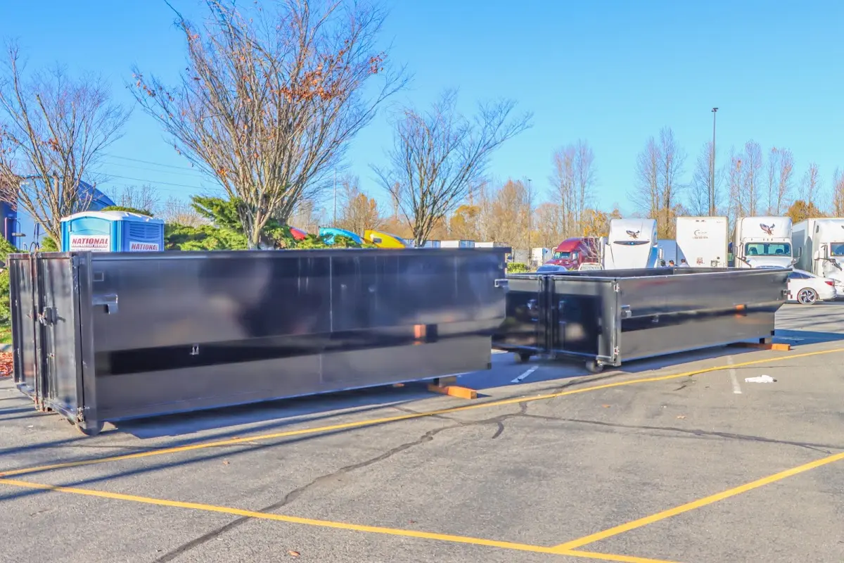 Professional dumpster rental service with roll-off container on residential driveway in La Crescenta-Montrose